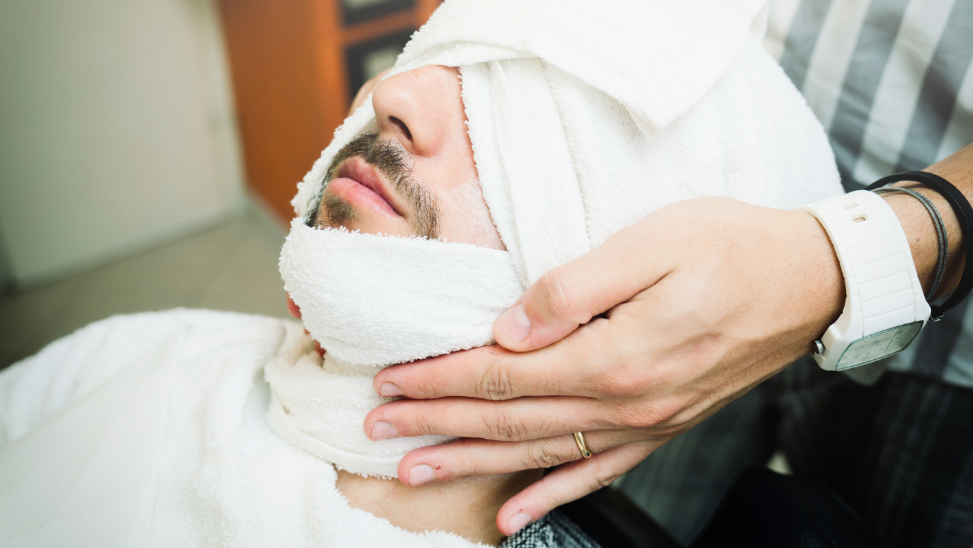 A man with a towel wrapped around his head